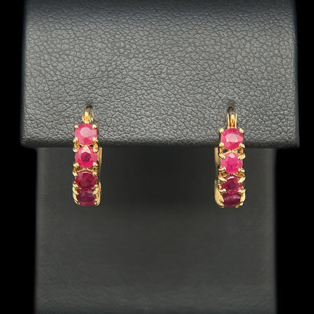 1.50ct. T.W. Ruby Huggie Earrings Yellow Gold - J42377